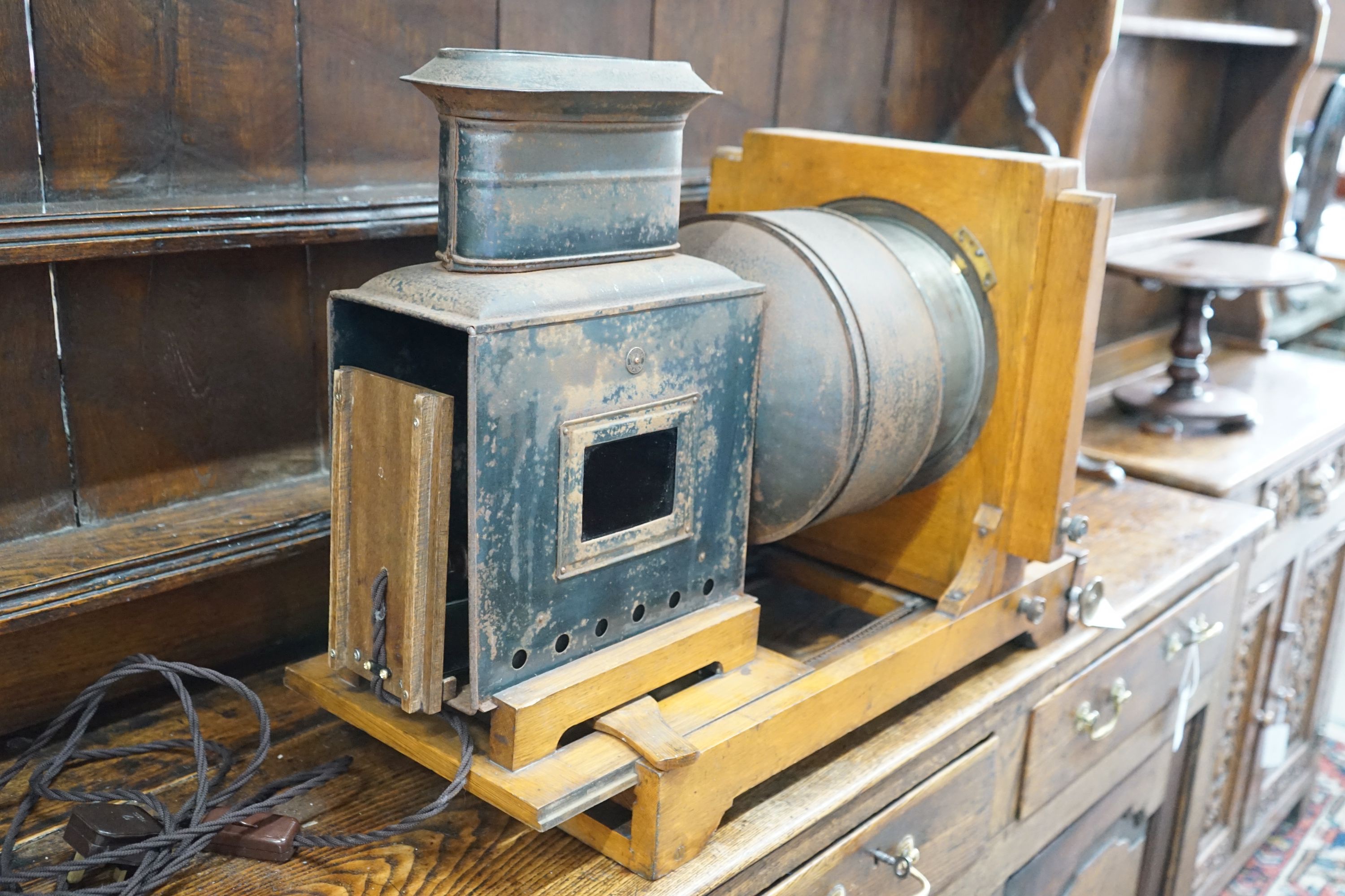 A Victorian oak magic lantern converted to electricity